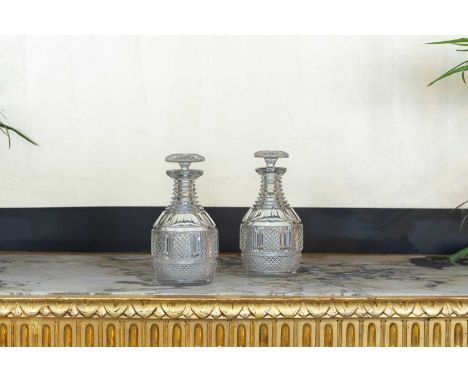 A pair of Regency cut-glass decanters, c.1820, each with step-cut necks and mushroom stoppers,12cm diameter23cm high (2)Condi