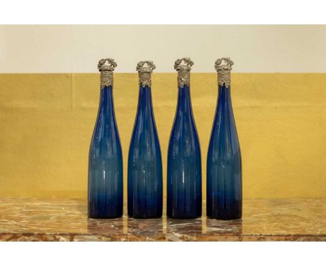 A set of four Victorian blue glass decanters,  c.1840, each with a grapevine stopper,  8cm diameter 36cm high (4)  Condition 