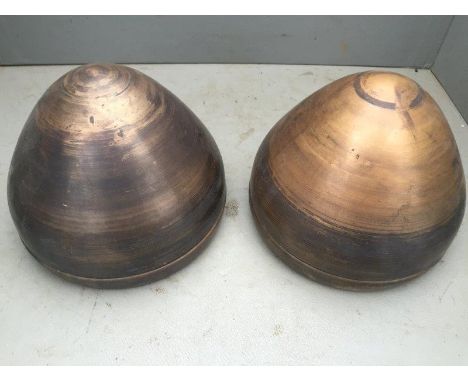 A pair of newly spun headlamp shells.