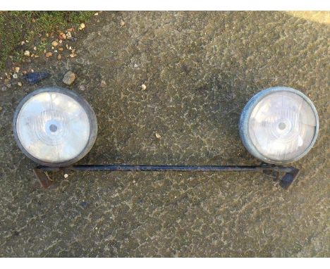 A pair of Lucas LBD165 headlamps on original headlamp bar. 