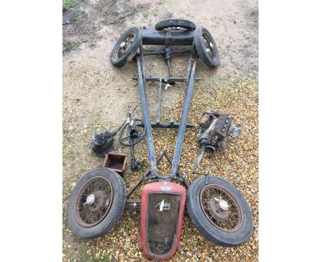 An Austin 7 kit of mechanical parts, late ruby model, comprising a chassis frame, front and rear axles, five wheels, a three 