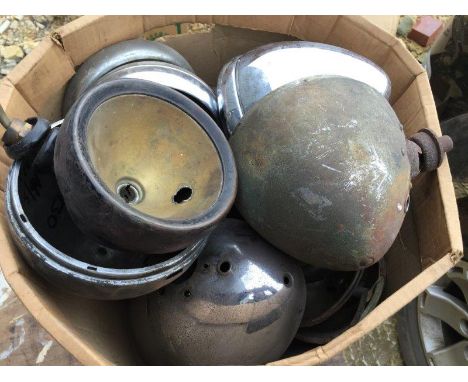 A large box of assorted Austin 7 headlamps, shells including one chummy headlamp. 