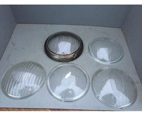 A small selection of original headlamp lenses including diamond pattern.