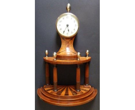 A continental satinwood cased mantel clock, having circular white enamel dial, the drum movement with platform lever escapeme