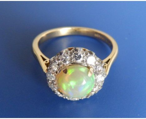 An opal & diamond set 18ct gold cluster ring