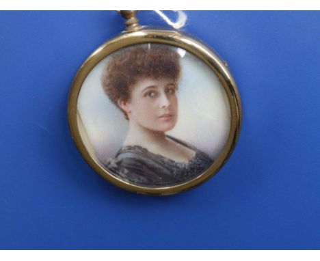 An Edwardian watercolour miniature – Portrait of a young woman – cut down to fit into later circular pendant frame