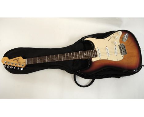Squier (by Fender) Stratocaster electric guitar with sunburst finish and soft case
