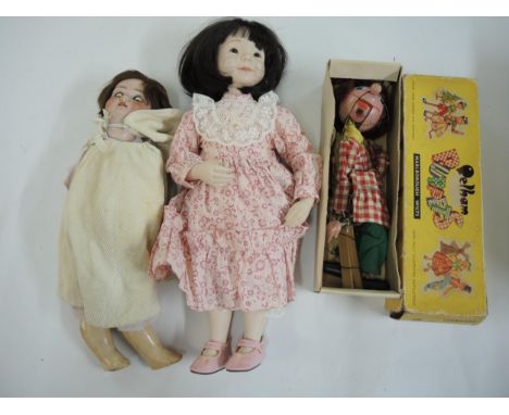 Simon and Halbig Geran bisque headed doll, together with a Pelham puppet and a modern bisque headded doll