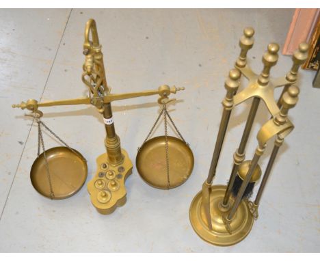 Pair of brass balance scales with weights, together with a brass companion set