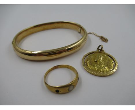 Yellow metal bangle, 12.3g, together with a yellow metal ring, 2g and a yellow metal pendant, 3.8gBangle is hollow, it is unm