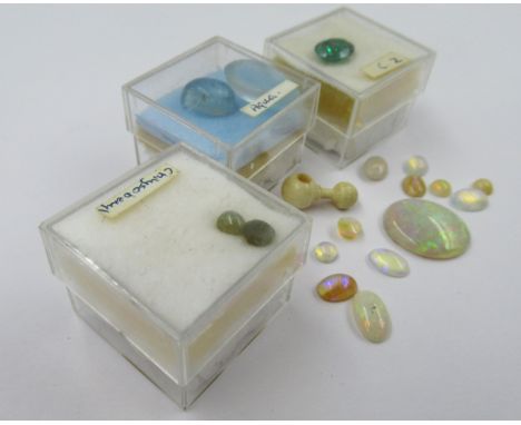 Oval loose opal together with a small quantity of other unmounted stones