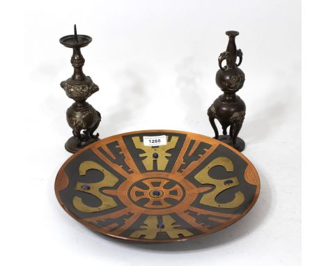 South American circular multi-metal wall plate inset with lapis lasuli, 29cm diameter, together with a Chinese bronze pricket