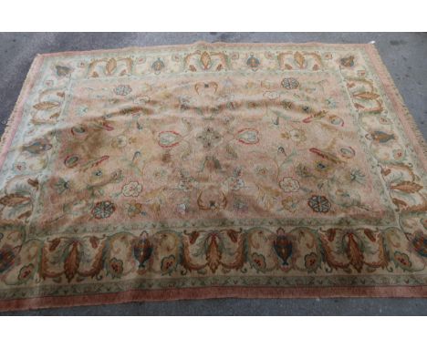 Machine woven Agra style carpet, the all-over floral design on a beige ground, 340 x 240cmCondition as shown in additional ph