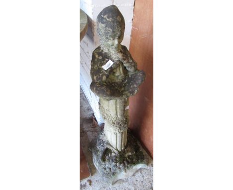 Weathered cast concrete garden figure of seated boy playing pipes, 56cm high