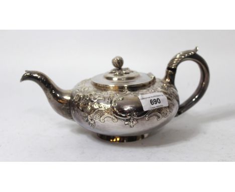 Late Georgian silver teapot of circular squat baluster form with embossed floral decoration, makers mark C.G. 16oz t