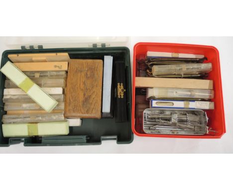 Two boxes containing various medical and dental tools