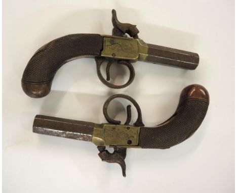 Pair of early 19th Century percussion pocket pistols with octagonal screw off barrelsBoth actions appear to be working althou