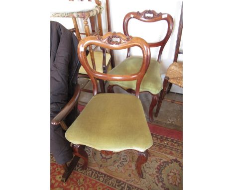Pair of Victorian carved rosewood balloon back dining chairs, together with a button upholstered low seat nursing chair and a