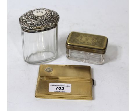 Silver and gilt cigarette case, silver topped cut glass dressing table bottle and another similar with plated cover