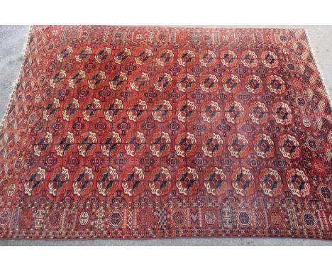 Tekke carpet with five rows of eleven gols on a red ground with borders, 285 x 200cmLooks to of had moth damage as shown in p
