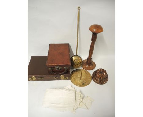 Two small leather cases, child's Christening gown, wooden wig stand, brass chestnut roaster, copper jelly mould, and a sundia