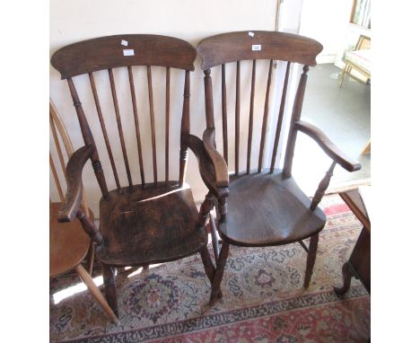 Pair of early 20th Century oak and beech stick back kitchen elbow chairs, on turned supports with H-stretchers