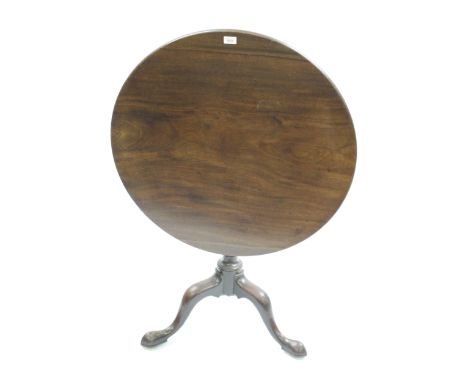 George III mahogany circular pedestal table, the tilt top above a bird cage base with turned wrythen stem above a tripod base