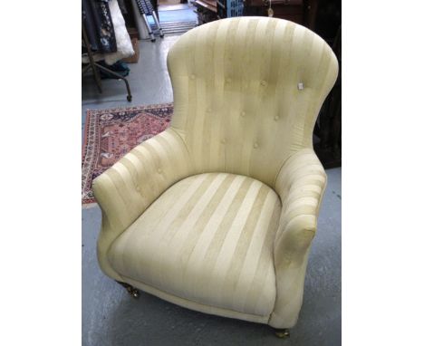 Pair of good quality Victorian style button upholstered drawing room chairs, covered in a gold stripe fabric, on turned taper