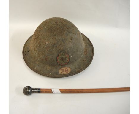 WWII British National Fire Service helmet together with a Kelcotta and Presidency Battalion swagger stick