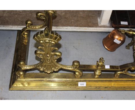 Victorian brass fender of spindle and scroll design, 136cm wide