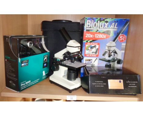 A Bresser Biolux AL microscope boxed, a Vivitar Limited Edition digital camera and a Logitech Quick cam Pro 9000 camera