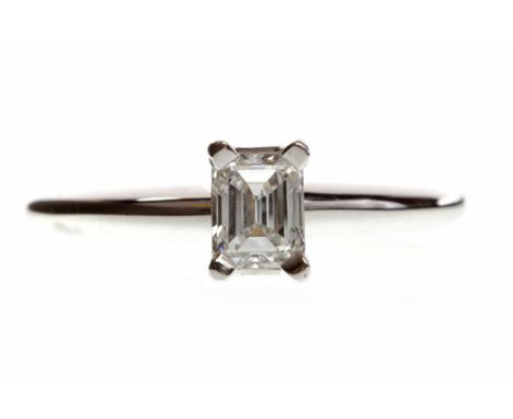 EIGHTEEN CARAT WHITE GOLD DIAMOND SOLITAIRE RINGwith a four claw set emerald cut diamond of approximately 0.45 carats, size O