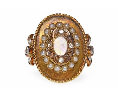 VICTORIAN STYLE OPAL AND PEARL RINGset with a central oval opal in a diamond surround, within a pearl halo, on ornate pearl a