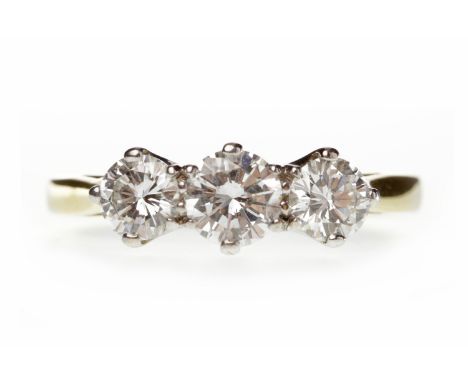 DIAMOND THREE STONE RINGset with a central stone of approximately 0.44 carats flanked by two smaller diamonds of approximatel