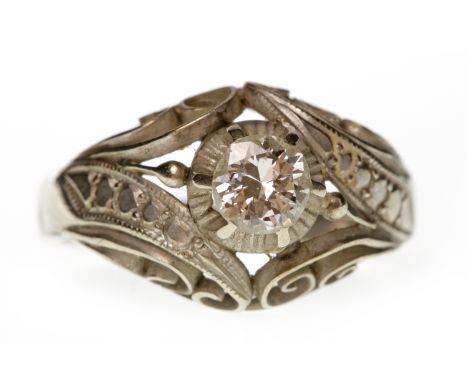 MID TWENTIETH CENTURY DIAMOND SINGLE STONE RINGthe broad pierced bezel set with a round brilliant cut diamond of approximatel