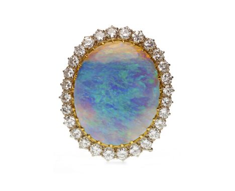 IMPRESSIVE BLACK OPAL AND DIAMOND BROOCHset with a large oval section of black opal 23x18.5x3.5mm, surrounded by round brilli