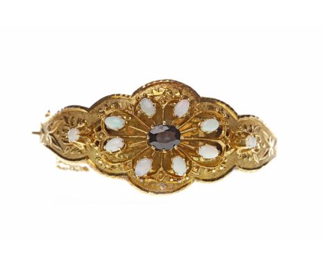 FOURTEEN CARAT GOLD OPAL AND SAPPHIRE BANGLEwith a central scalloped edge pierced section with a high set oval sapphire 7.7x6