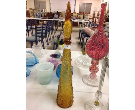 Tall brown moulded glass decanter.