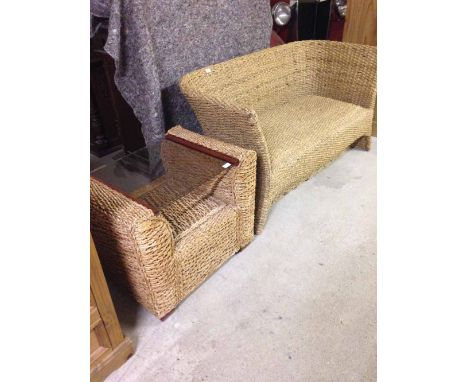 Woven seagrass 2 seater sofa together with a matching coffee table with seagrass base and glass top