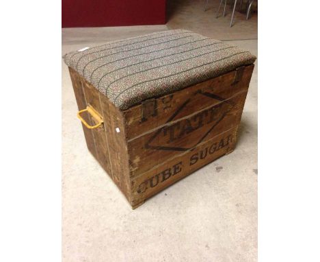 Vintage sugar cube crate with metal handles converted to a seat with padded top.
