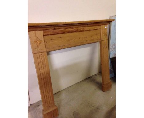 A pine fire surround. 142cm wide.
