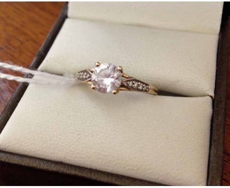 Ladies 9ct gold ring set with 0.75ct Cubic Zirconia and Cubic Zirconia shoulders. Size O.