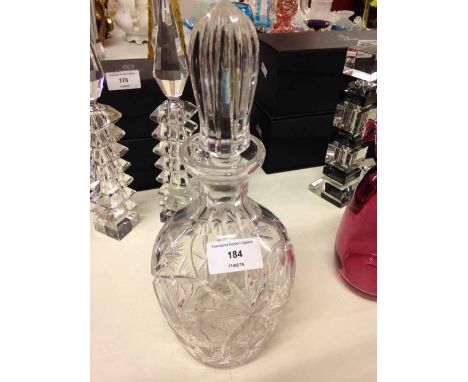 A cut crystal decanter.