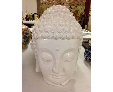 White ceramic buddha head. 36cm tall