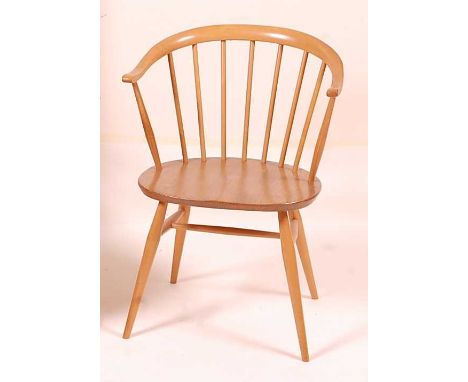 An Ercol blond elm stickback tub elbow chair, raised on turned supports, w.55cmCondition report: Stands well and is structura