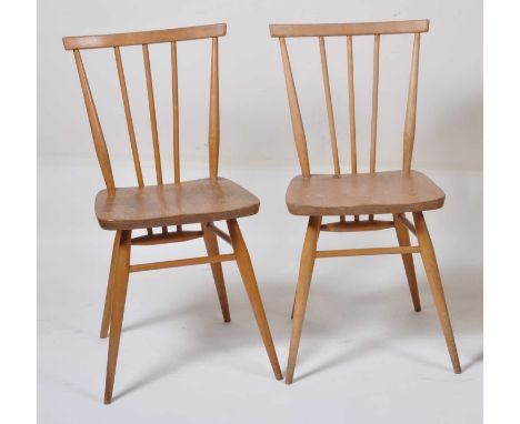 A pair of 1960s Ercol light elm stickback kitchen chairs, each w.38cm 