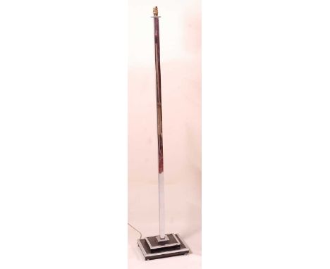 An Art Deco chrome and black painted metal inset standard lamp, the square column to conforming stepped base, on squat bun su