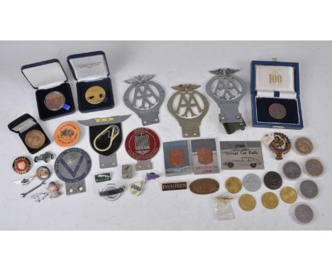 A collection of various motoring memorabilia, predominantly being mid-20th century, to include three AA badges, Brooklands ba