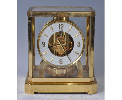 A Jaeger LeCoultre Atmos clock, housed in a gilt brass and glazed case, with white enamel chapter ring stamped LeCoultre Atmo