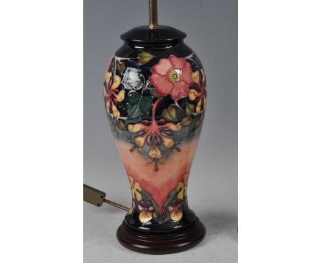 A large Moorcroft pottery table lamp, in the Hibiscus Moon pattern, of upper baluster form, underglaze painted and tube-line 